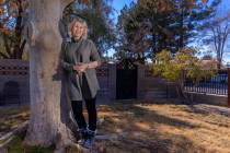 Laura McSwain, president of the Water Fairness Coalition, poses outside her home in the McNeil ...