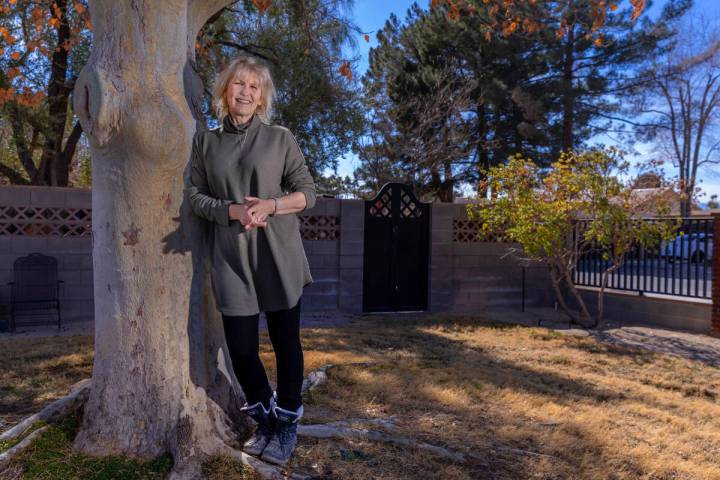 Laura McSwain, president of the Water Fairness Coalition, poses outside her home in the McNeil ...