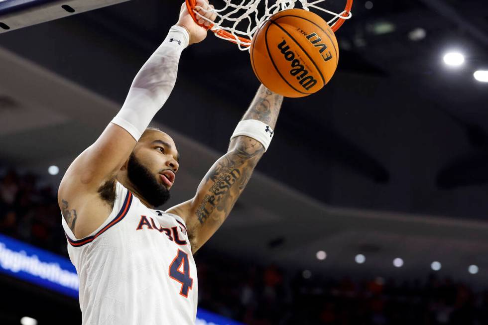 Auburn forward Johni Broome dunks during the second half of an NCAA college basketball game aga ...
