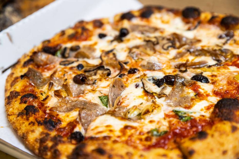 A finished pizza by restaurant owner and chef Giovanni Mauro at Old School Pizzeria in Las Vega ...