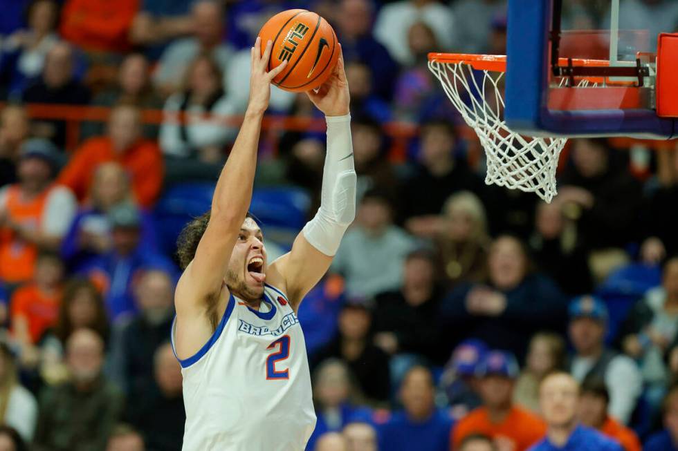 Boise State forward Tyson Degenhart (2) goes in for the dunk against Utah State in the second h ...