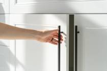 When installing handles on kitchen cabinet doors, creating a template will ensure that all of t ...