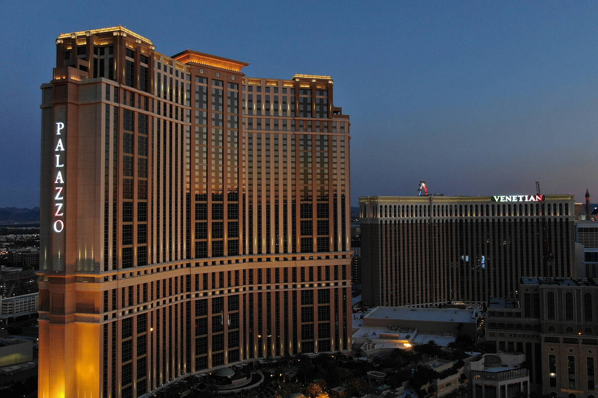 An aerial photo of the Palazzo and Venetian hotel casino properties at dusk, on Friday, April 3 ...