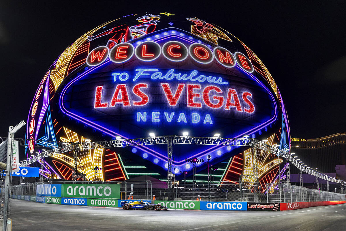 A race care navigates around the Sphere during the qualifying round for the Formula 1 Las Vegas ...