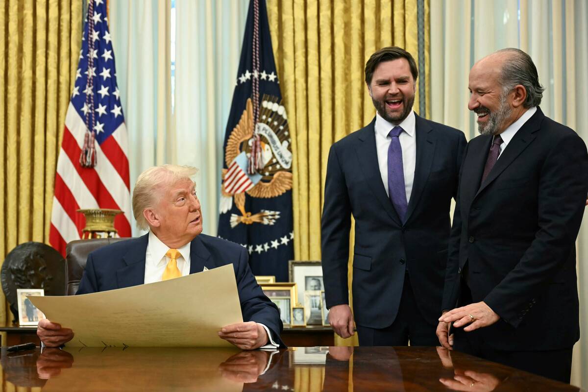 President Donald Trump, left, speaks during a ceremonial swearing-in for Secretary of Commerce ...