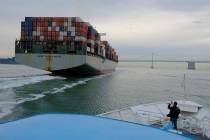 A container ship heads toward the San Francisco-Oakland Bay Bridge in San Francisco. (AP Photo/ ...