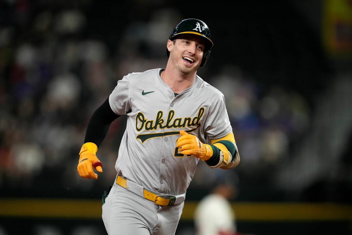 Oakland Athletics designated hitter Brent Rooker rounds the bases after hitting a home run duri ...