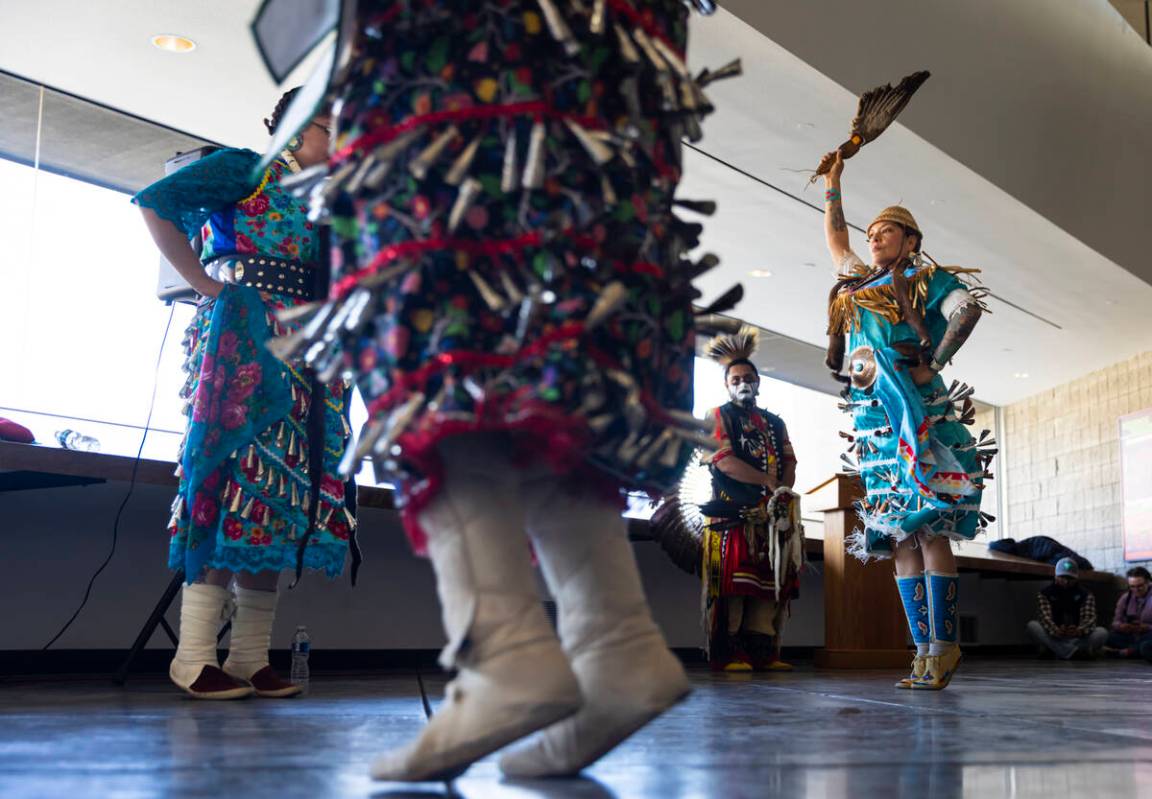Fawn Douglas, co-founder of Nuwu Art and Activism Studios, right, participates in a jingle danc ...