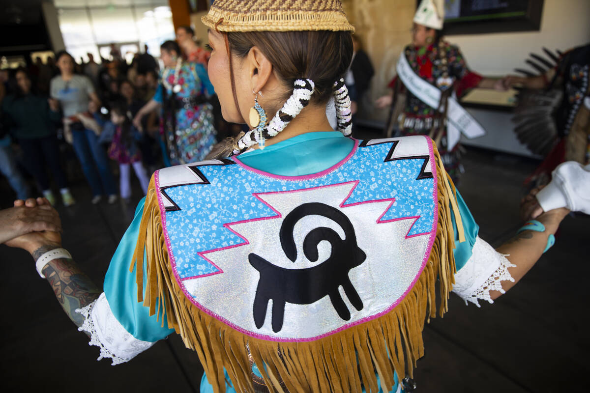 Fawn Douglas, co-founder of Nuwu Art, participates in a group dance during the Winter Gathering ...