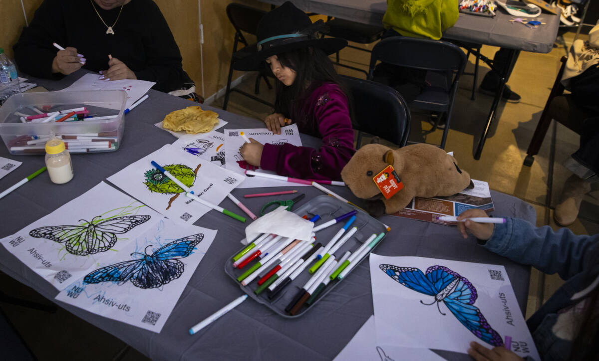 Bunny Hartzell, 9, of Las Vegas, works on a drawing during the Winter Gathering at the Red Rock ...