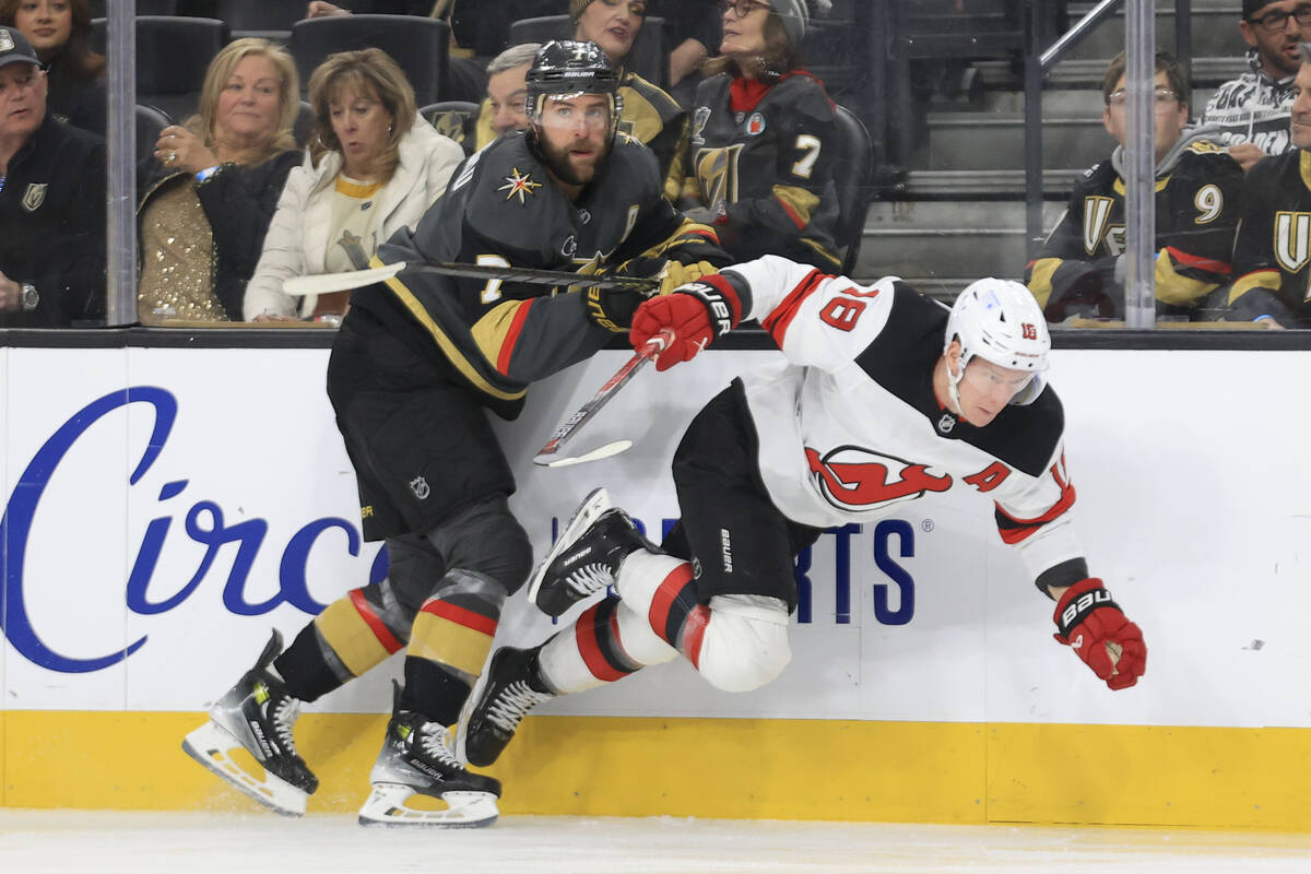 Vegas Golden Knights defenseman Alex Pietrangelo (7) checks New Jersey Devils left wing Ondrej ...
