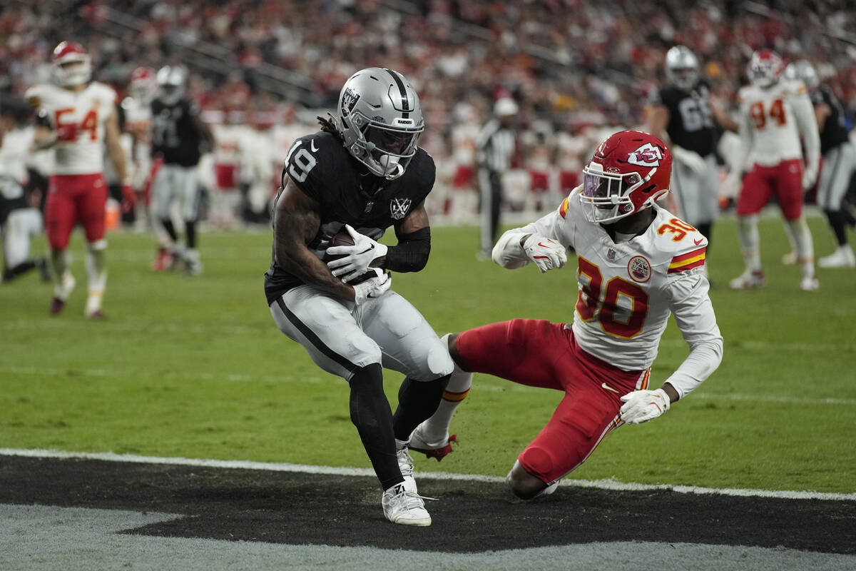 Las Vegas Raiders wide receiver DJ Turner (19) catches a touchdown pass as Kansas City Chiefs c ...