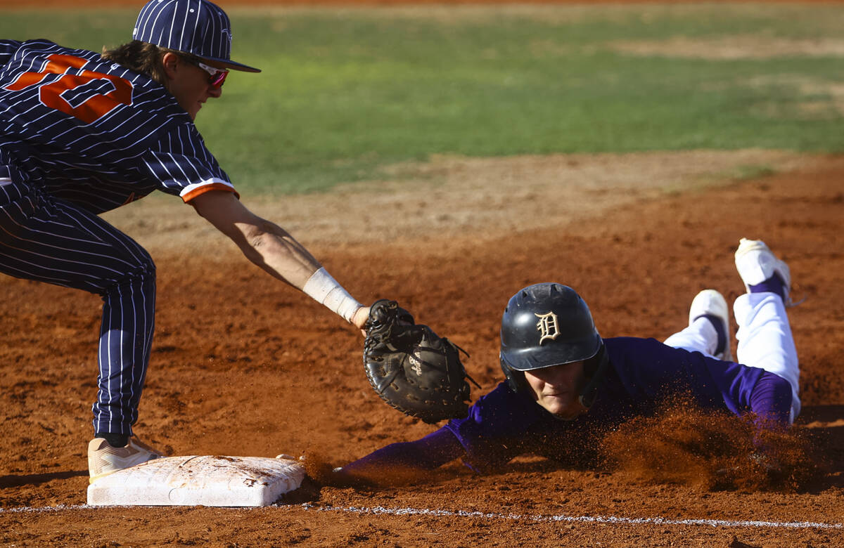 Durango's center fielder Carson Crosby (23) jumps back to first base under pressure from Legacy ...