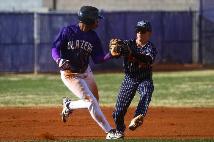 Durango's Alexander Mercurius (7) gets tagged out by Legacy's Easton Lake (15) during a basebal ...