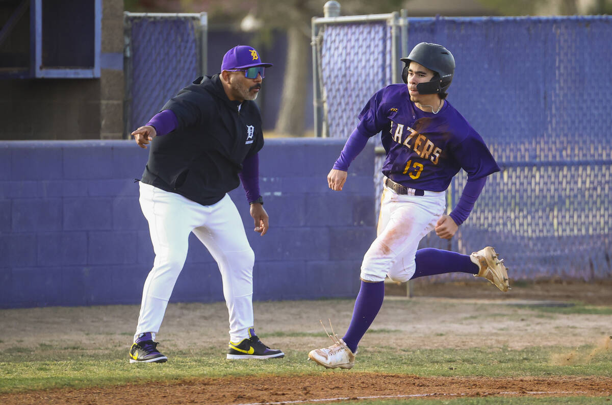 Durango's Rocco Germano (13) rounds third base to score a run against Legacy during a baseball ...