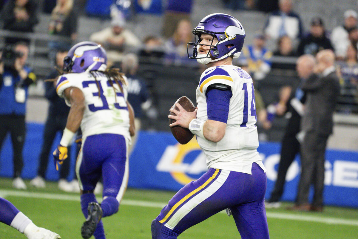 Minnesota Vikings quarterback Sam Darnold (14) looks to throw the ball during the second half o ...