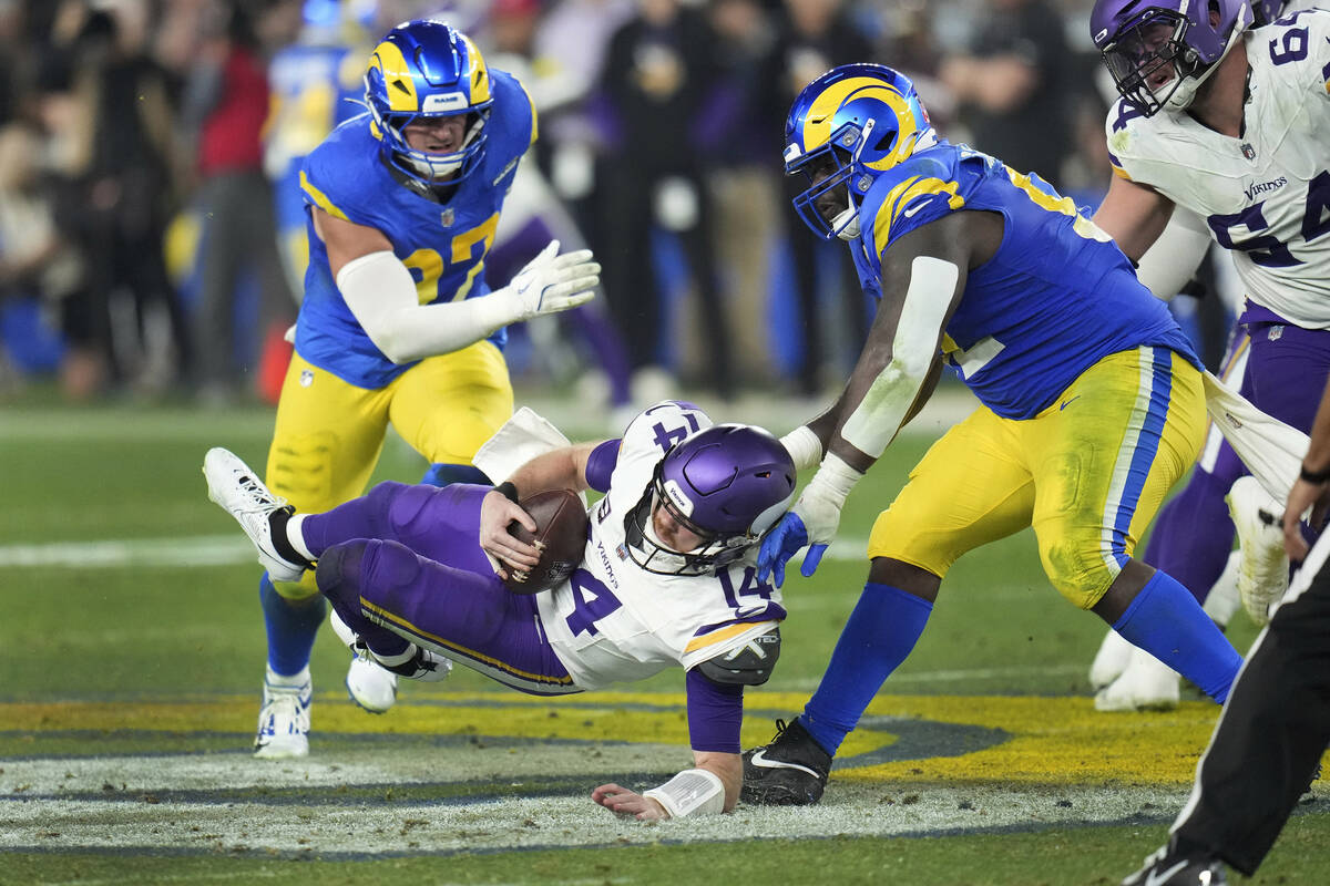 Los Angeles Rams defensive tackle Neville Gallimore (92) sacks Minnesota Vikings quarterback Sa ...