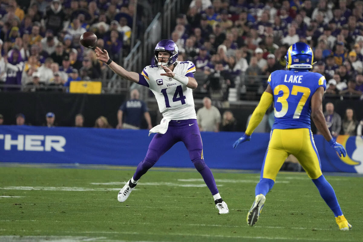Minnesota Vikings quarterback Sam Darnold (14) throws as Los Angeles Rams safety Quentin Lake ( ...