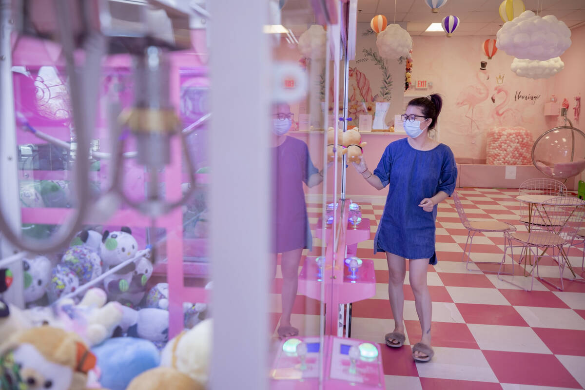 Pink Wa Wa employee Elyse Wu holds a plush toy from a claw machine. (Elizabeth Brumley/Las Vega ...