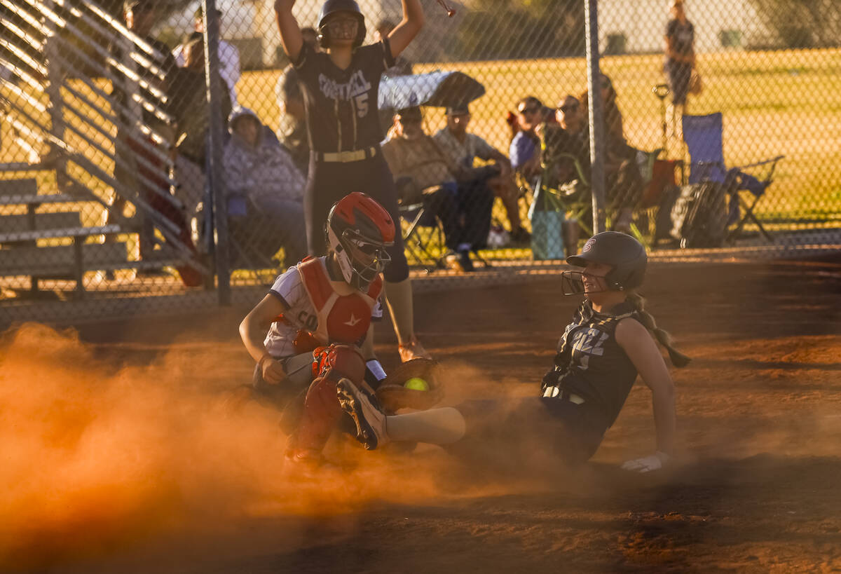 Foothill's Jordan Ackerman (1) scores a run against Coronado during a softball game at Coronado ...