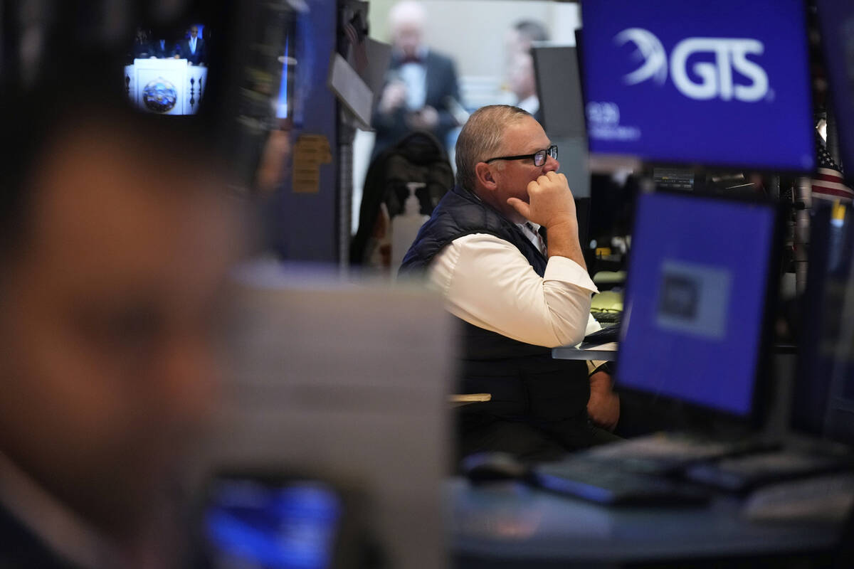 People work on the floor at the New York Stock Exchange in New York, Tuesday, March 4, 2025. (A ...