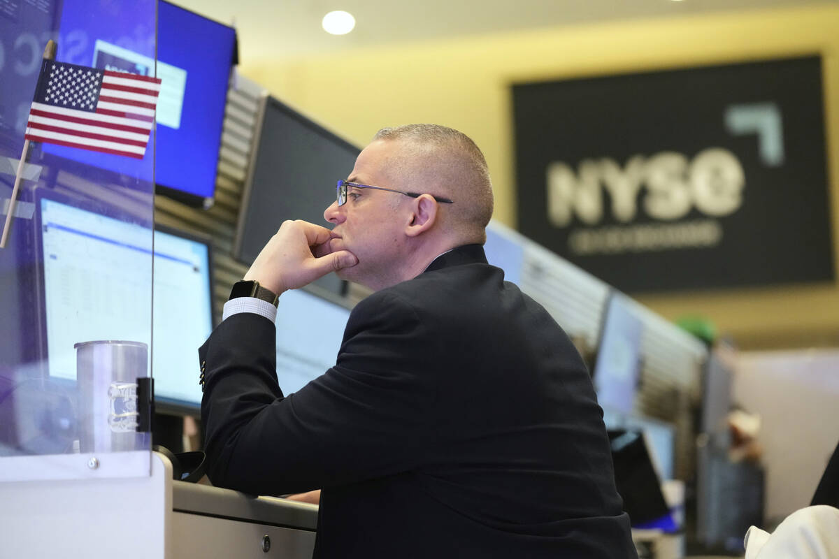 People work on the options floor at the New York Stock Exchange in New York, Tuesday, March 4, ...