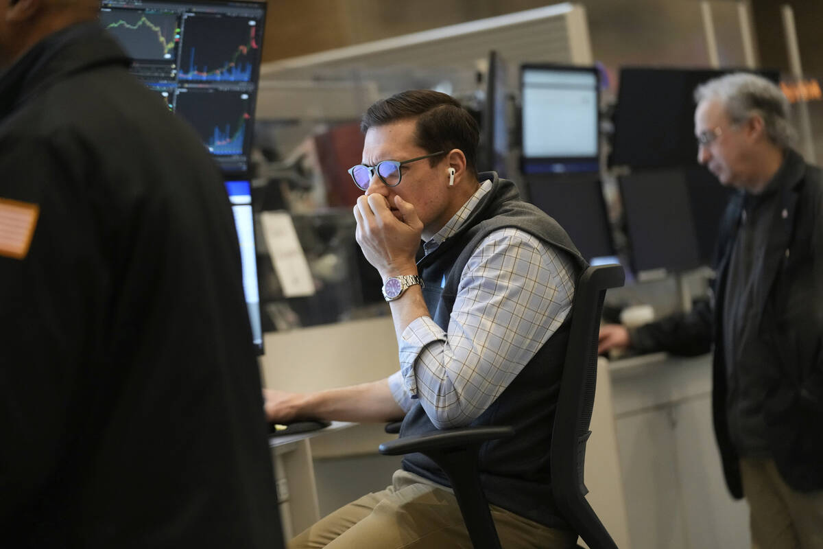 People work on the options floor at the New York Stock Exchange in New York, Tuesday, March 4, ...