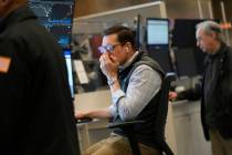 People work on the options floor at the New York Stock Exchange in New York, Tuesday, March 4, ...