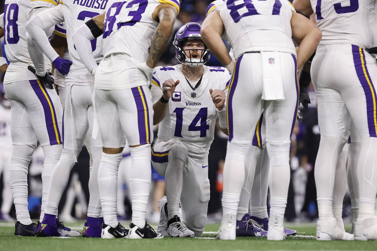 Minnesota Vikings quarterback Sam Darnold (14) calls a play in a huddle during the second half ...