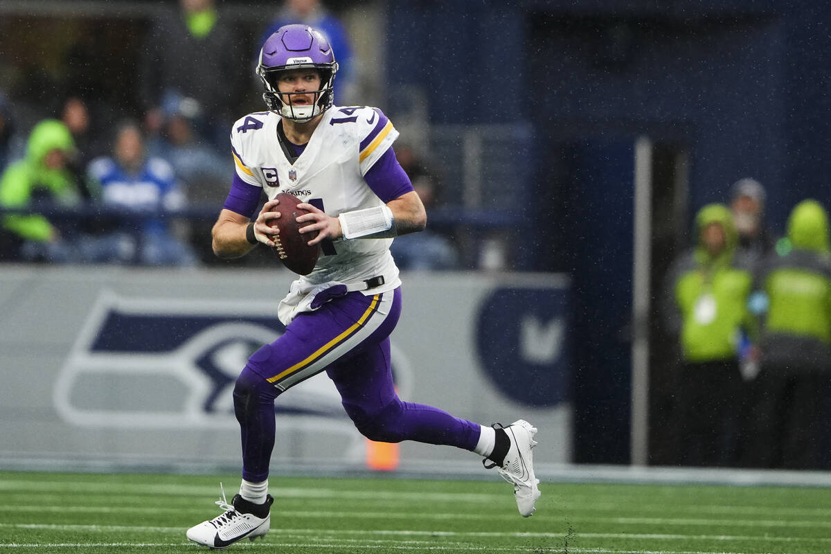 Minnesota Vikings quarterback Sam Darnold looks to pass during an NFL football game against th ...