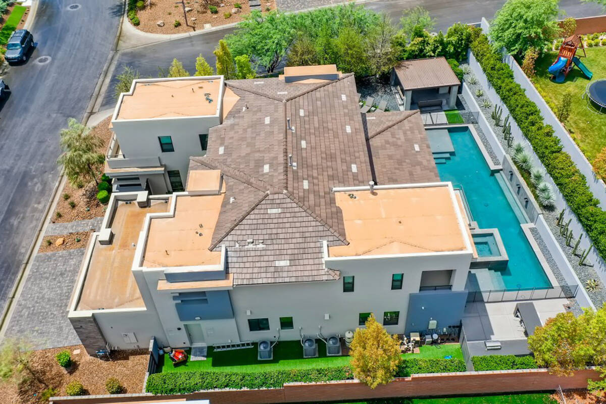 The home in The Ridges has 4,619 square feet with five bedrooms, 4 and a half baths and a three ...