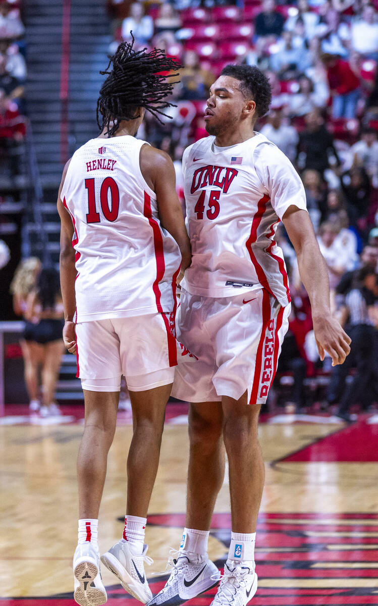 UNLV guard Jaden Henley (10) and forward Jeremiah Cherry (45) celebrate another big score again ...