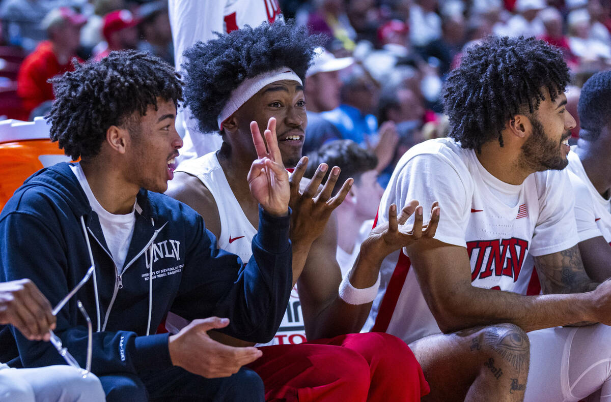 UNLV guard Dedan Thomas Jr. (11) and teammates are excited about the lead over the San Diego St ...