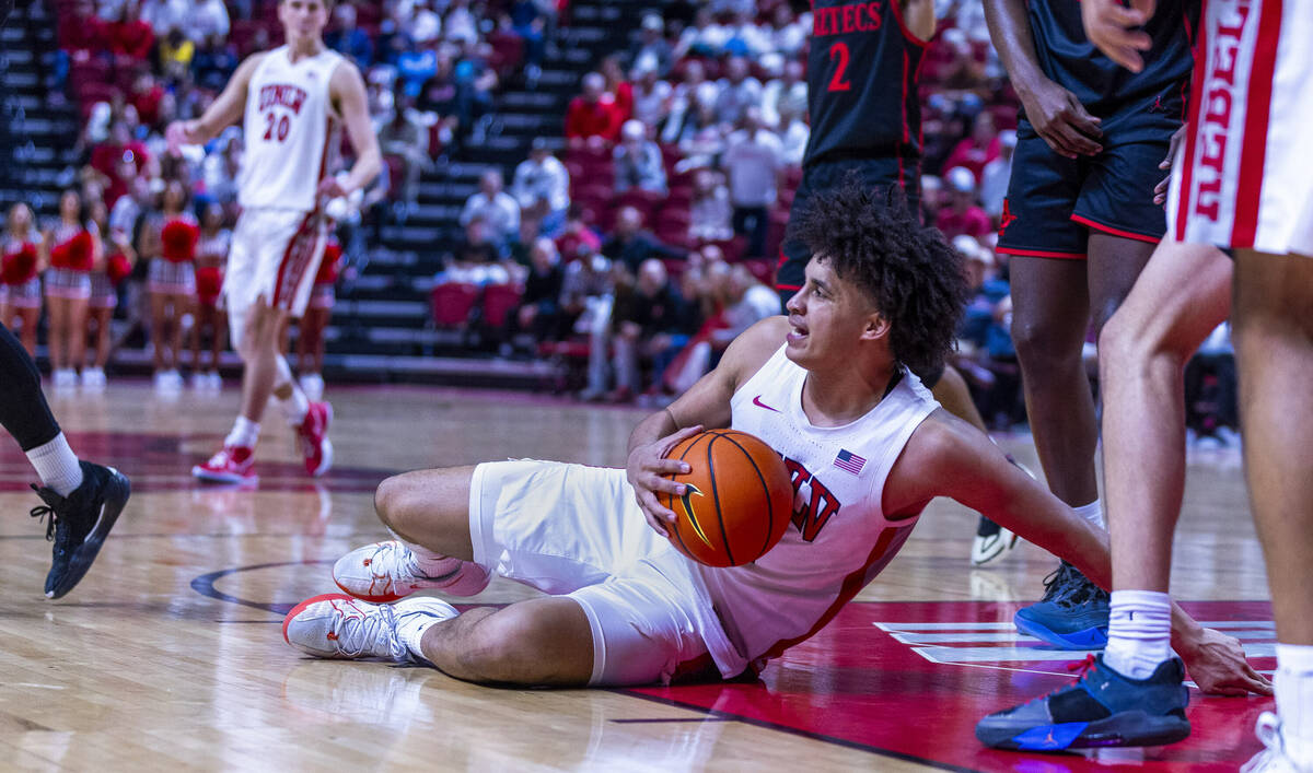 UNLV forward Jalen Hill (1) slides with the ball after a hard foul against the San Diego State ...