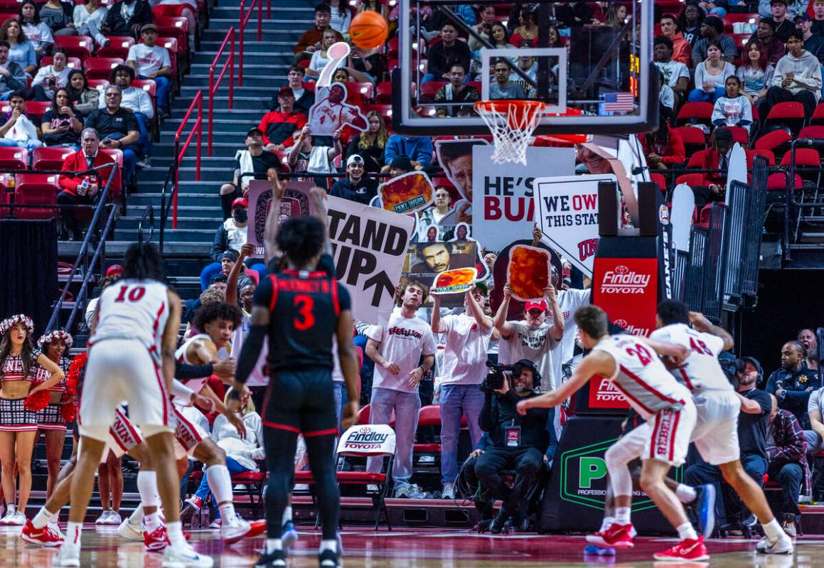UNLV fans do their best to distract a San Diego State Aztecs player shooting free throws during ...