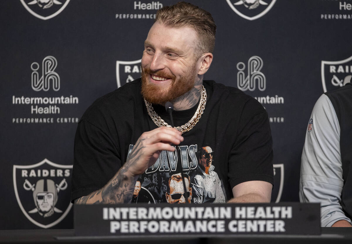 Raiders defensive end Maxx Crosby smiles during a news conference after receiving a contract ex ...