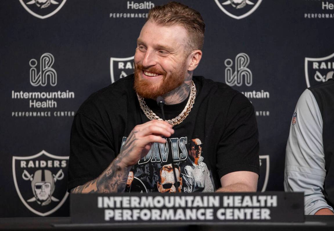 Raiders defensive end Maxx Crosby smiles during a news conference after receiving a contract ex ...
