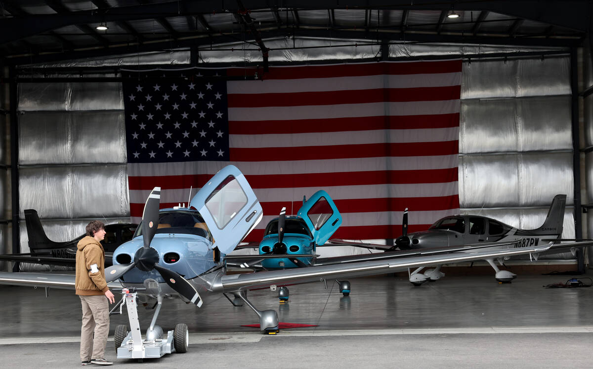Workers prepare airplanes for student flights or rentals at All In Aviation’s Henderson ...