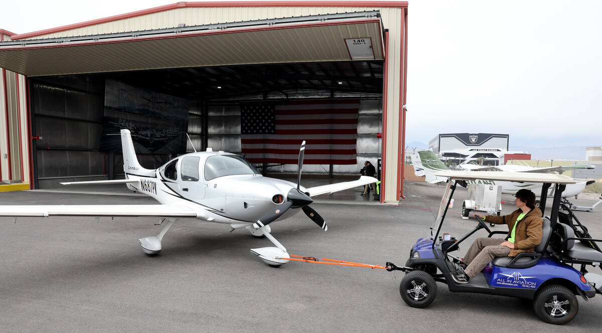 Workers prepare airplanes for student flights or rentals at All In Aviation’s Henderson ...
