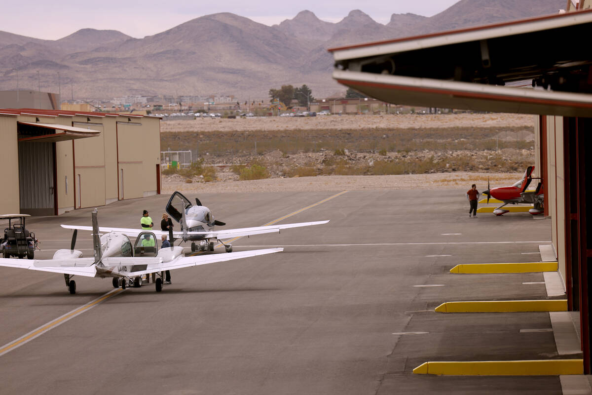 Workers prepare airplanes for student flights or rentals at All In Aviation’s Henderson ...