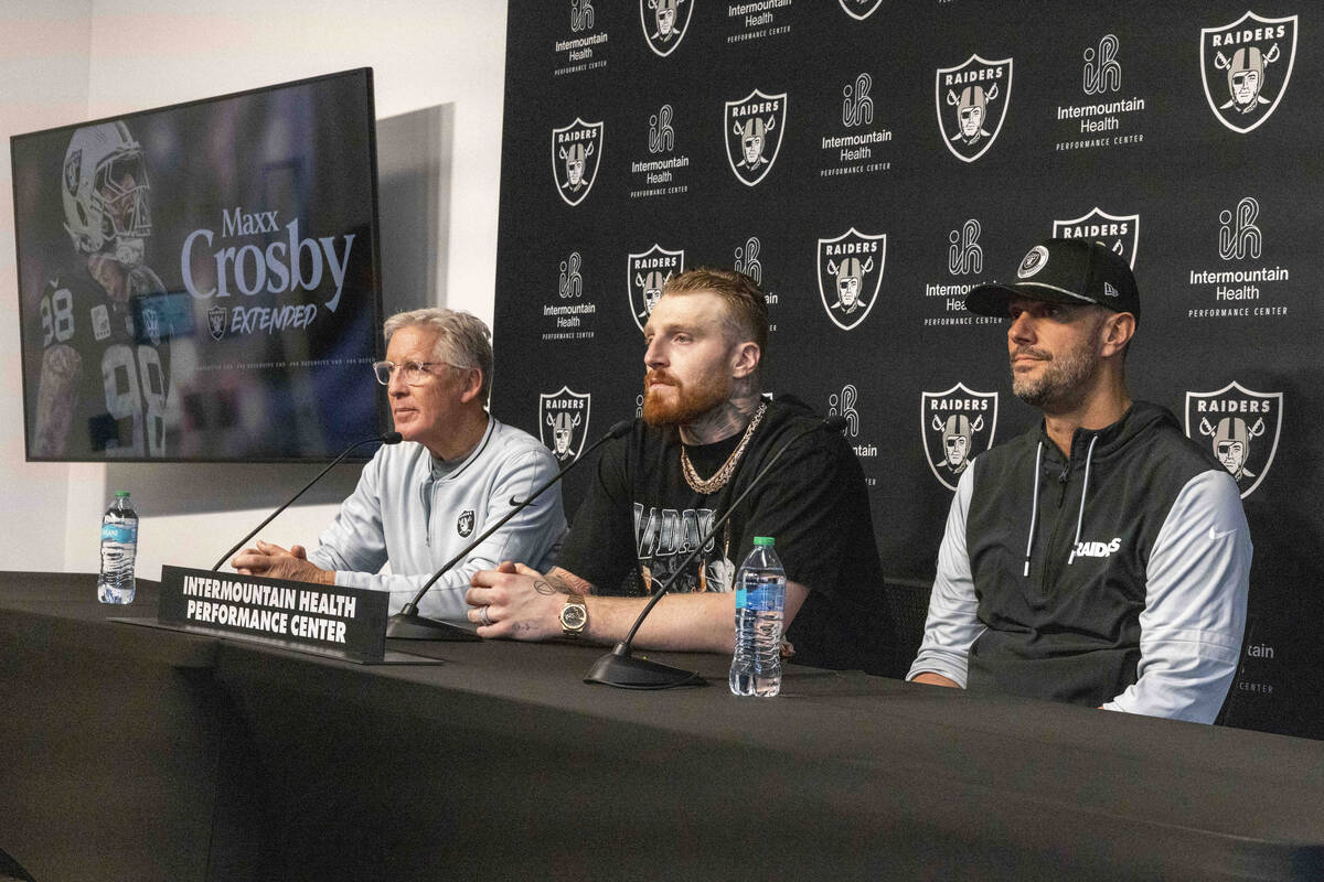 Raiders head coach Pete Carroll, left, defensive end Maxx Crosby, center, and general manager J ...