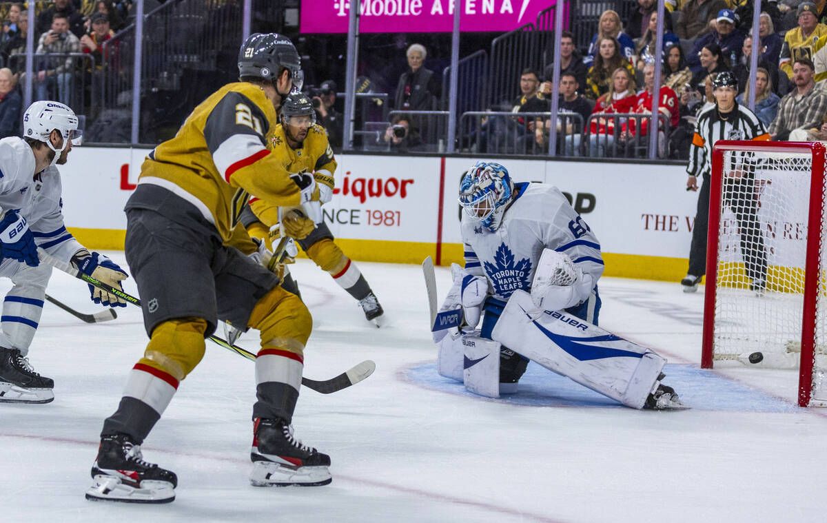 Golden Knights center Brett Howden (21) and Golden Knights right wing Keegan Kolesar (55) team ...