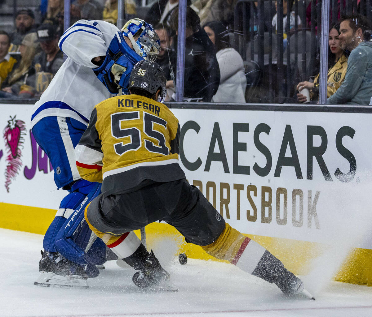 Golden Knights right wing Keegan Kolesar (55) attempts to steal the puck from Toronto Maple Lea ...
