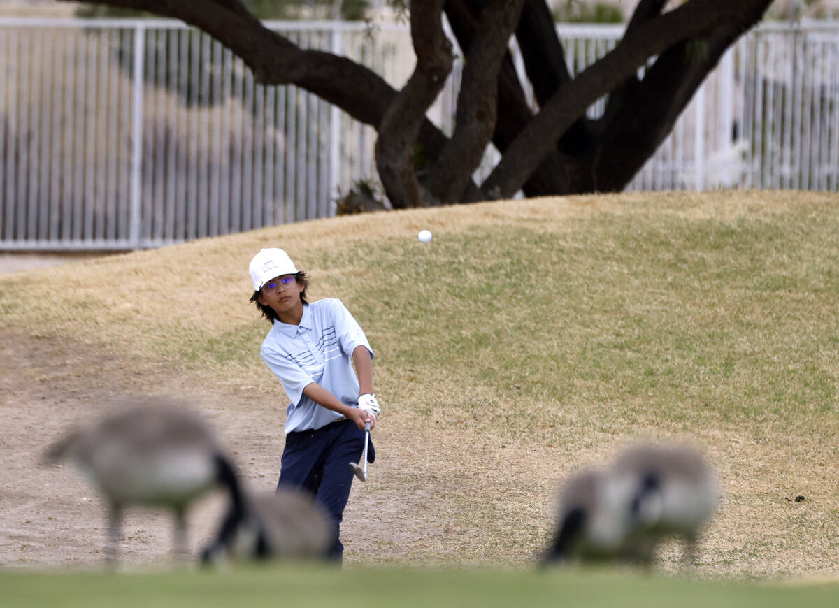 Foothill's Tyler Sanchez hits to the fourth green during Class 5A boys golf Desert League match ...