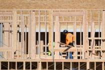 Houses are seen under construction on Gentle Swan Street in D.R. Horton’s Symmetry devel ...