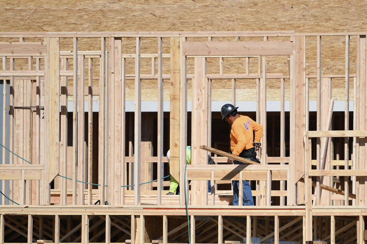 Houses are seen under construction on Gentle Swan Street in D.R. Horton’s Symmetry developmen ...