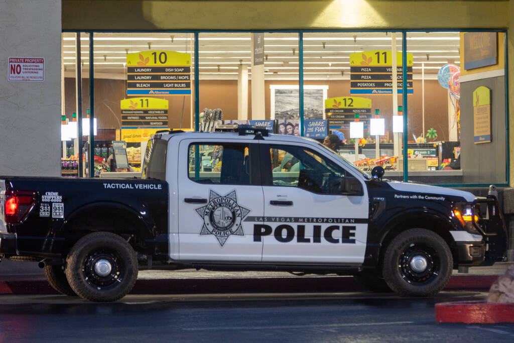 A Metropolitan Police Department vehicle sits outside of Albertsons in the 1700 block of East C ...