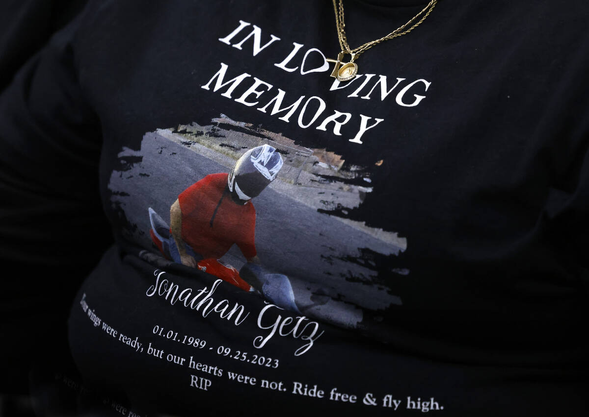 Samantha Potts, a friend of a shooting victim Jonathan Getz, wearing a shirt with a photo of Ga ...