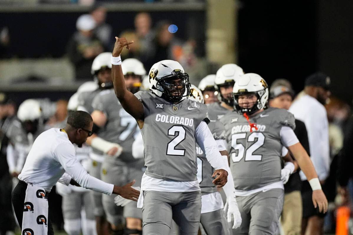 Colorado quarterback Shedeur Sanders (2) warms up before an NCAA college football game Saturday ...