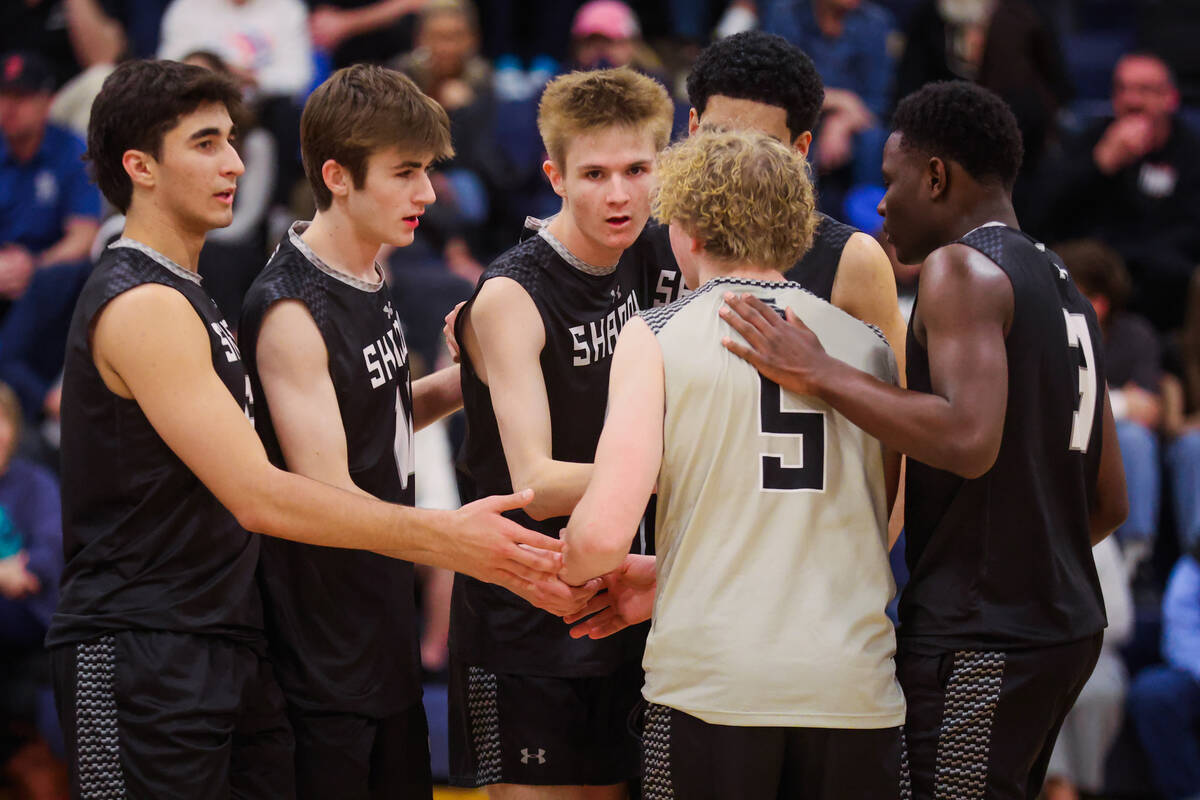 Shadow Ridge teammates regroup during a high school boys volleyball game between Palo Verde and ...